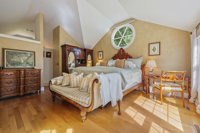 bedroom featuring wood-type flooring and lofted ceiling