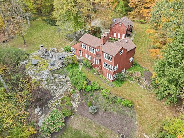 birds eye view of property with a forest view