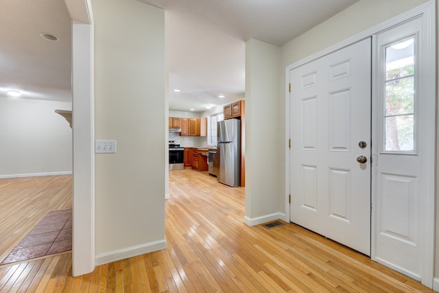 foyer featuring light hardwood / wood-style flooring