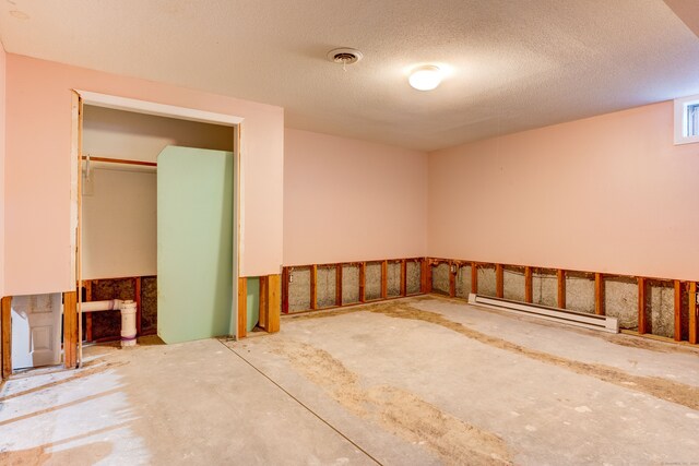 garage featuring a baseboard radiator