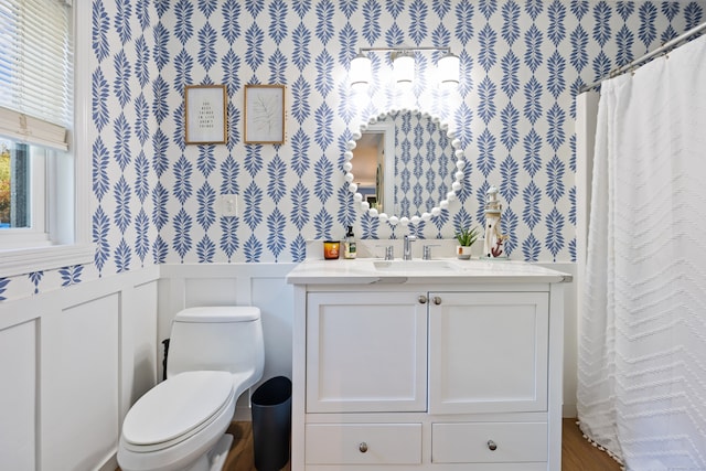 bathroom featuring toilet and vanity