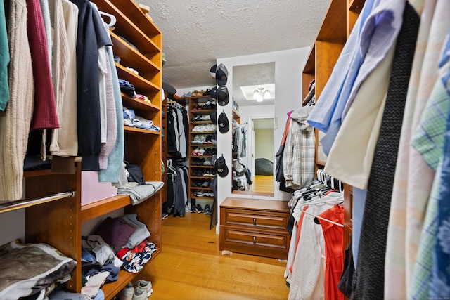 walk in closet featuring light hardwood / wood-style flooring