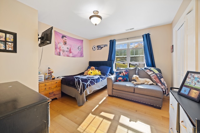 bedroom with light hardwood / wood-style floors