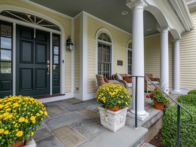 doorway to property featuring covered porch