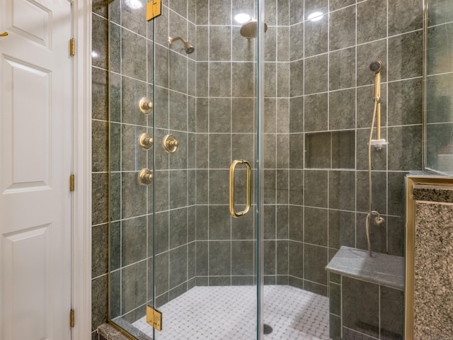 bathroom with a shower with door