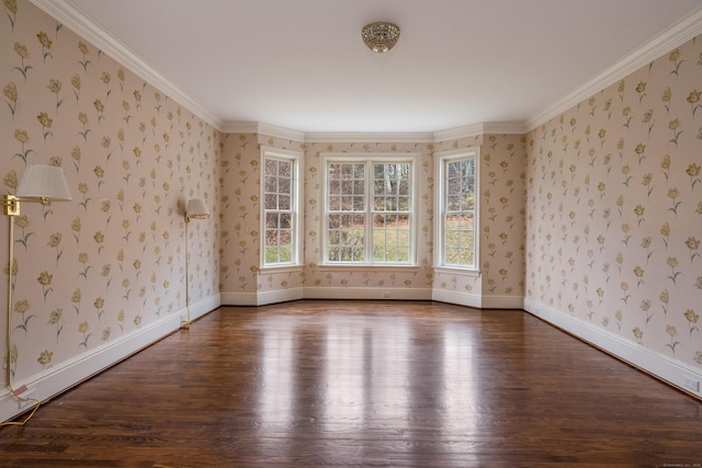 spare room with dark hardwood / wood-style floors and crown molding