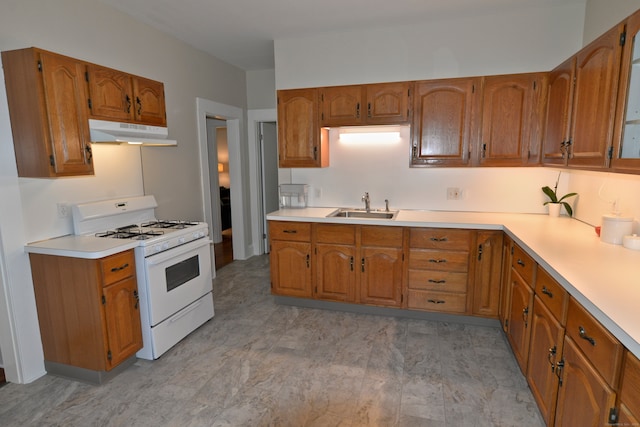 kitchen featuring sink, white range with gas stovetop, and light hardwood / wood-style floors