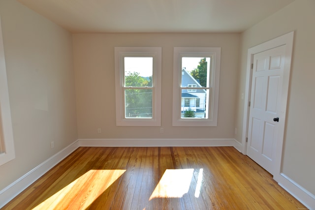 spare room featuring light hardwood / wood-style flooring