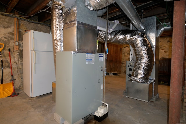 utility room featuring heating unit