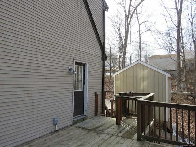 wooden terrace with an outbuilding