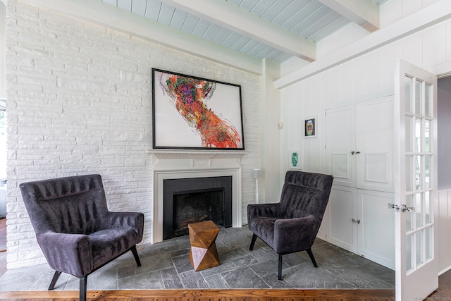 sitting room with beamed ceiling