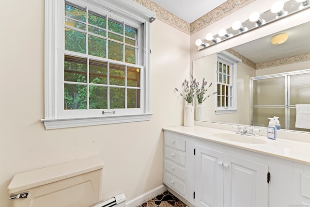 bathroom with a textured ceiling, vanity, toilet, and a shower with shower door