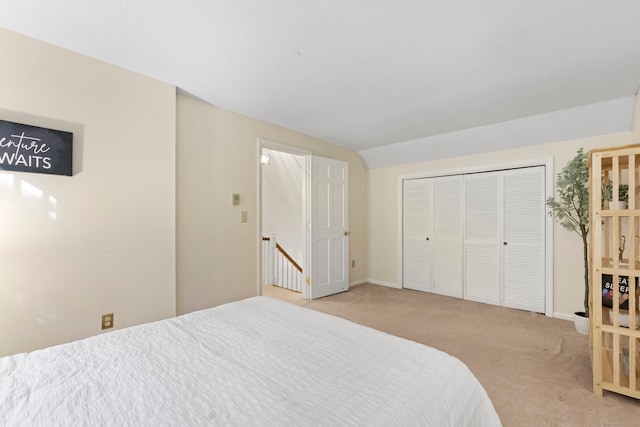 carpeted bedroom featuring a closet