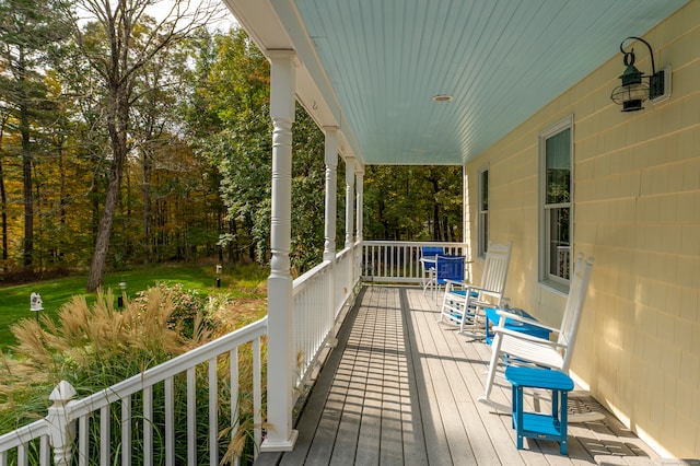 wooden terrace featuring a porch