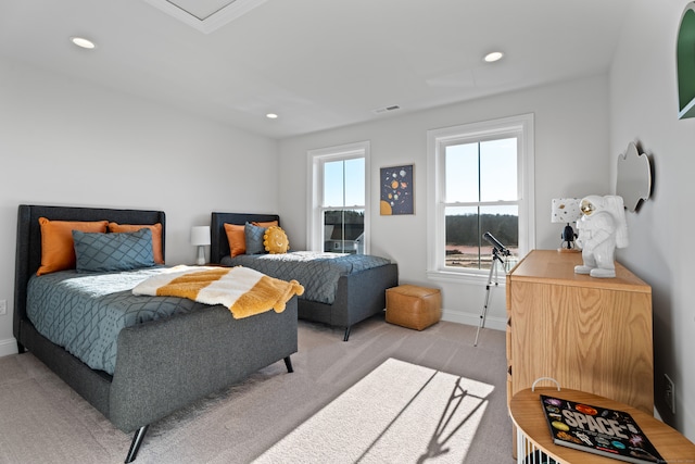 bedroom with light colored carpet