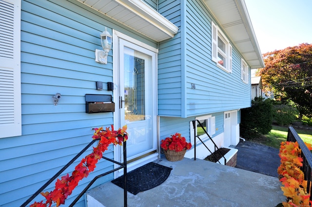 view of exterior entry featuring a patio