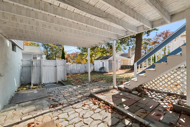 view of patio / terrace with a storage unit