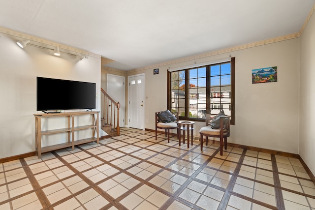 living area with light tile patterned flooring and rail lighting