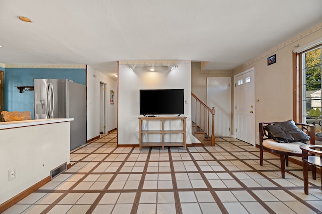 living room with light tile patterned flooring