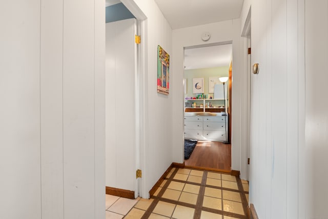 corridor with light tile patterned floors