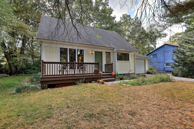 view of front facade with a deck and a front yard