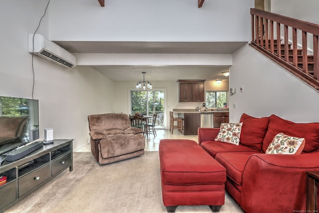 living room with a wall mounted AC, light colored carpet, and a chandelier