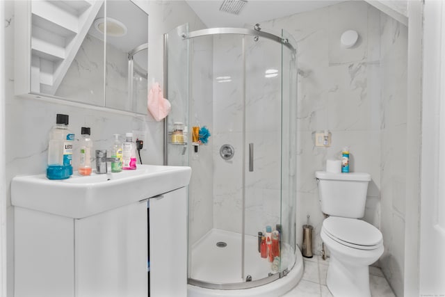 bathroom with tile walls, a shower with door, vanity, and toilet