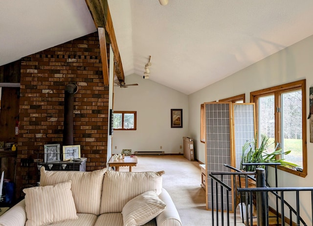 carpeted living room with ceiling fan, vaulted ceiling, a wood stove, and a baseboard heating unit