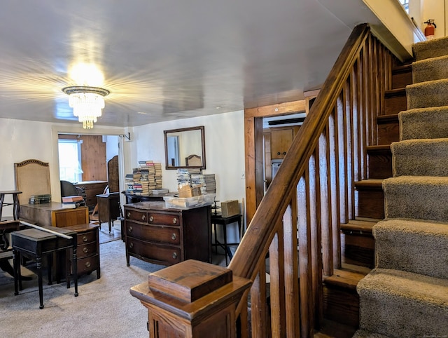 home office with an inviting chandelier and light colored carpet