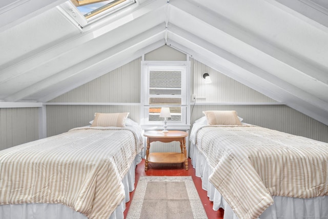 bedroom with vaulted ceiling with skylight and wooden walls