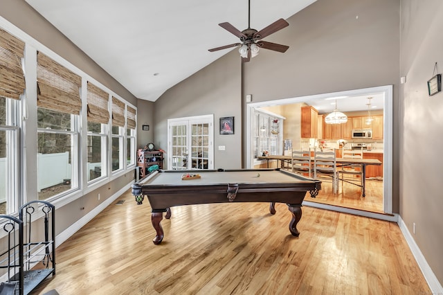 recreation room featuring pool table, light wood-type flooring, and high vaulted ceiling