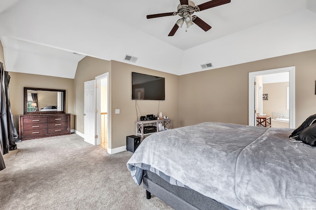 bedroom with lofted ceiling, ensuite bathroom, ceiling fan, and light colored carpet