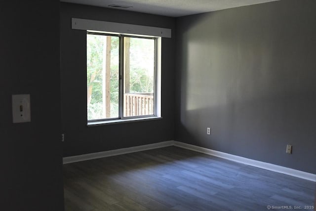 1423 Quinnipiac Ave Unit 807, New Haven, CT 06513 - empty room featuring healthy amount of natural light, dark wood-style floors, and baseboards
