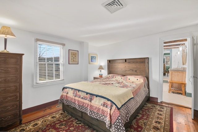 bedroom with wood-type flooring