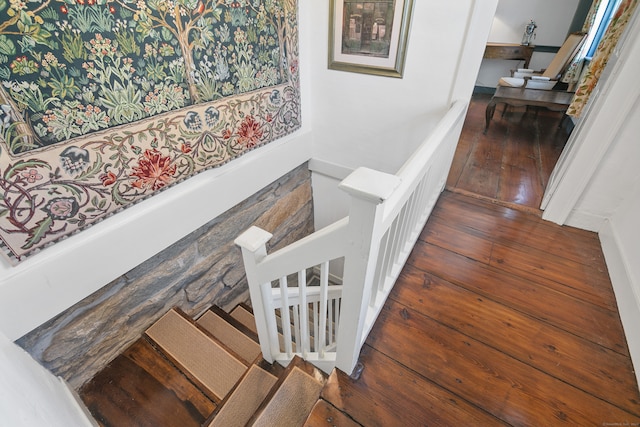 stairs featuring wood-type flooring