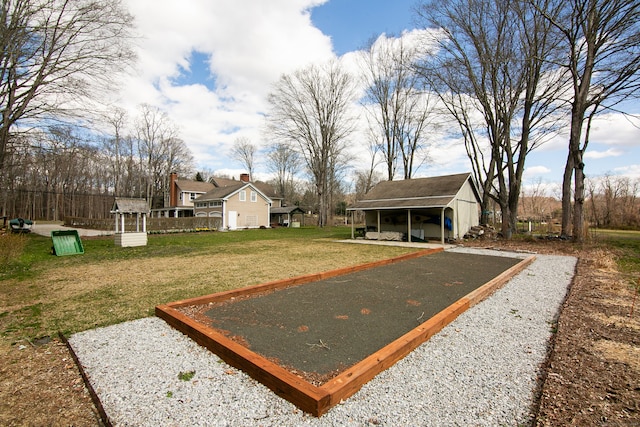 view of property's community with a yard