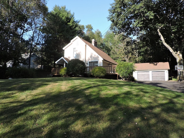 view of home's exterior with a wooden deck and a yard