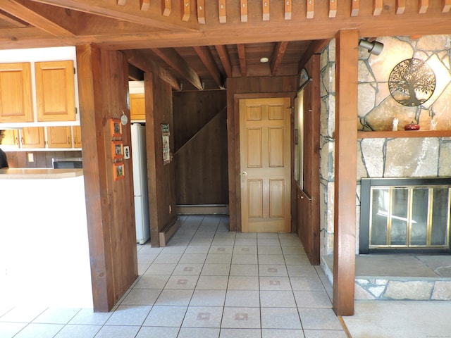 corridor featuring wood walls