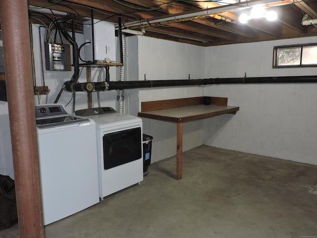 basement featuring washer and dryer and electric panel