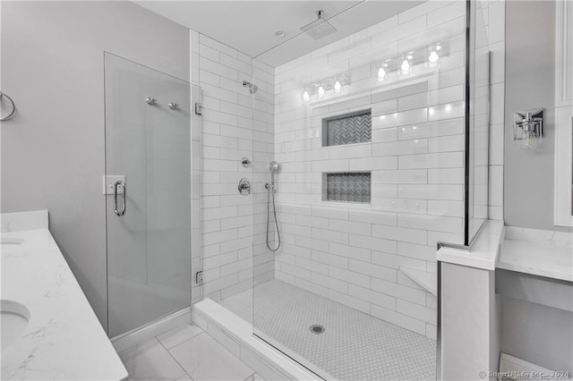 bathroom featuring vanity and a shower with shower door