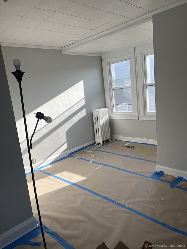 empty room featuring radiator heating unit