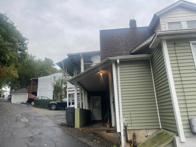 view of side of home featuring a garage