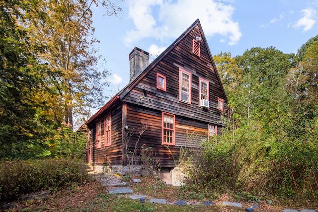 view of home's exterior with cooling unit