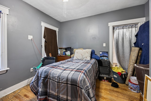 bedroom featuring ceiling fan and hardwood / wood-style floors