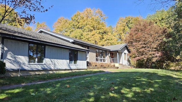 view of home's exterior with a lawn