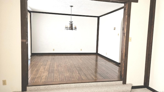 unfurnished dining area featuring an inviting chandelier