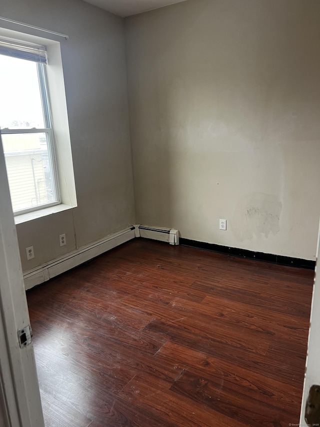 empty room with dark wood-type flooring