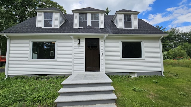 107 N Hollow Rd, Hartland, CT 06027 - cape cod home featuring a front yard and a shingled roof
