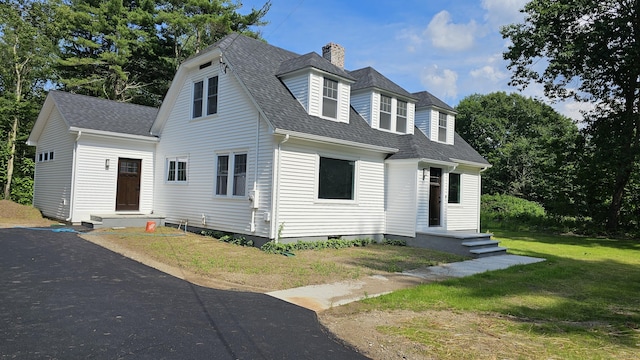 107 N Hollow Rd, Hartland, CT 06027 - view of front of property with roof with shingles, a chimney, and a front lawn