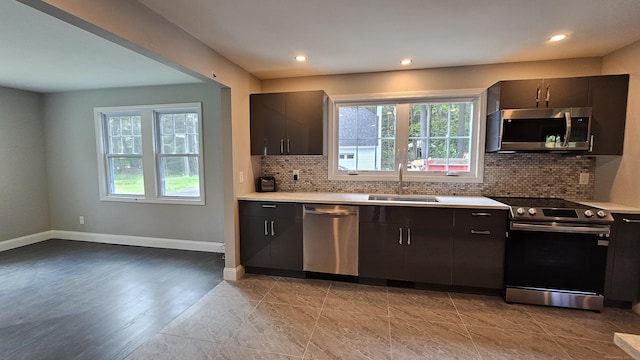 107 N Hollow Rd, Hartland, CT 06027 - kitchen featuring appliances with stainless steel finishes, plenty of natural light, a sink, tasteful backsplash, and recessed lighting